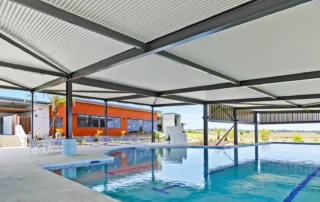 ARCPANEL DeltaMax insulated roofing over an aquatic centre swimming pool